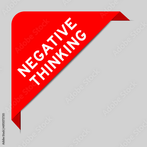 Red color of corner label banner with word negative thinking on gray background