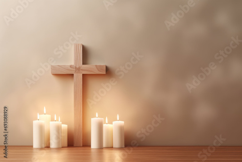 christian cross with candles on wooden floor in room, copy space