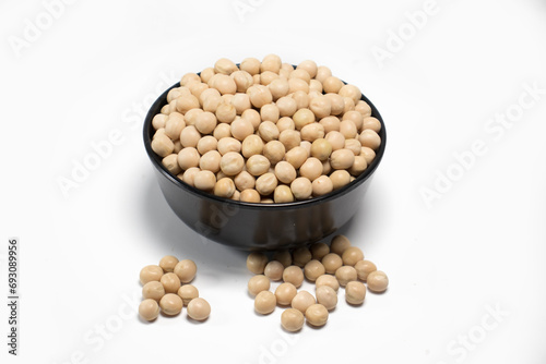 freshly harvested domestic soybeans in a black unique bowl in white background top side view