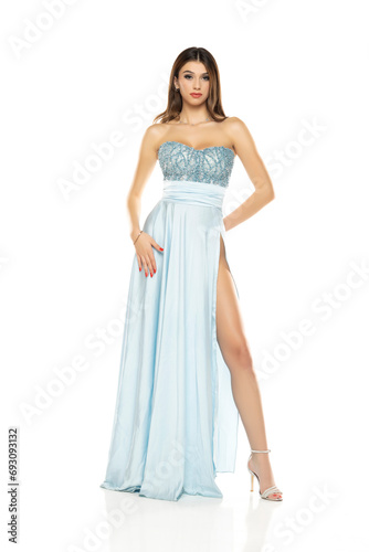 Full length of gorgeous elegant sensual brunette woman wearing fashion blue evening dress isolated on white background © vladimirfloyd