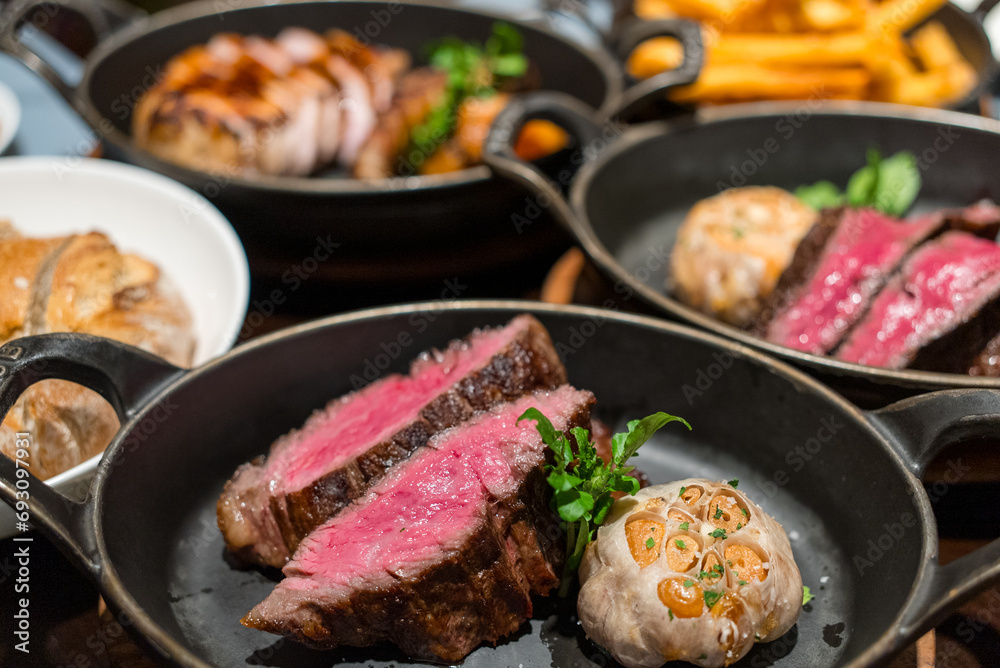 Juicy steak sliced on the cast iron Juicy steak sliced on the cast iron