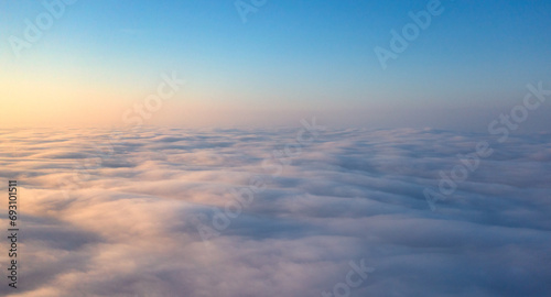 Fototapeta Naklejka Na Ścianę i Meble -  Dawn's Awakening: Illuminating the Sky Beyond the Cloud Veil