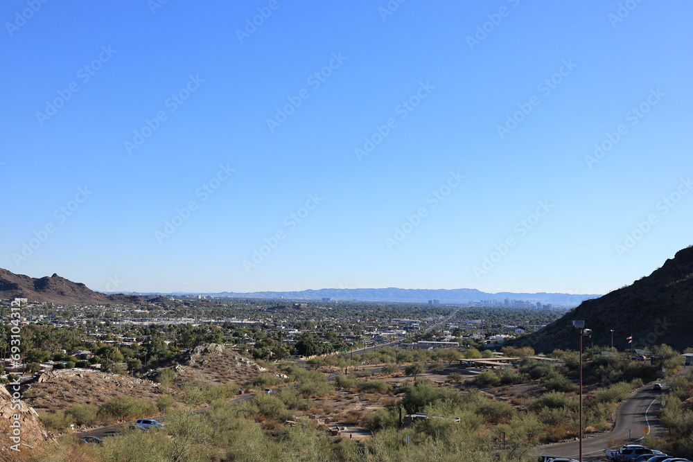Arizona Capital City of Phoenix downtown under cloudless sky as seen from North Mountain Park toward South mountains