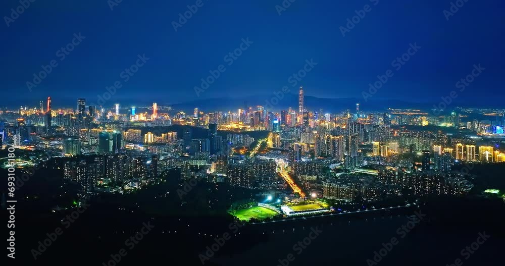 Aerial shot of city city buildings skyline at night in Shenzhen, Guangdong Province, China Aerial shot of city city buildings skyline at night in Shenzhen, Guangdong Province, China