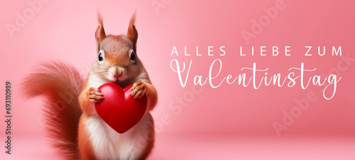 Alles Liebe zum Valentinstag, Grußkarte mit deutschem Text - Niedliches stehendes Eichhörnchen hält rotes Herz , isoliert auf pinkem Hintergrund © Corri Seizinger