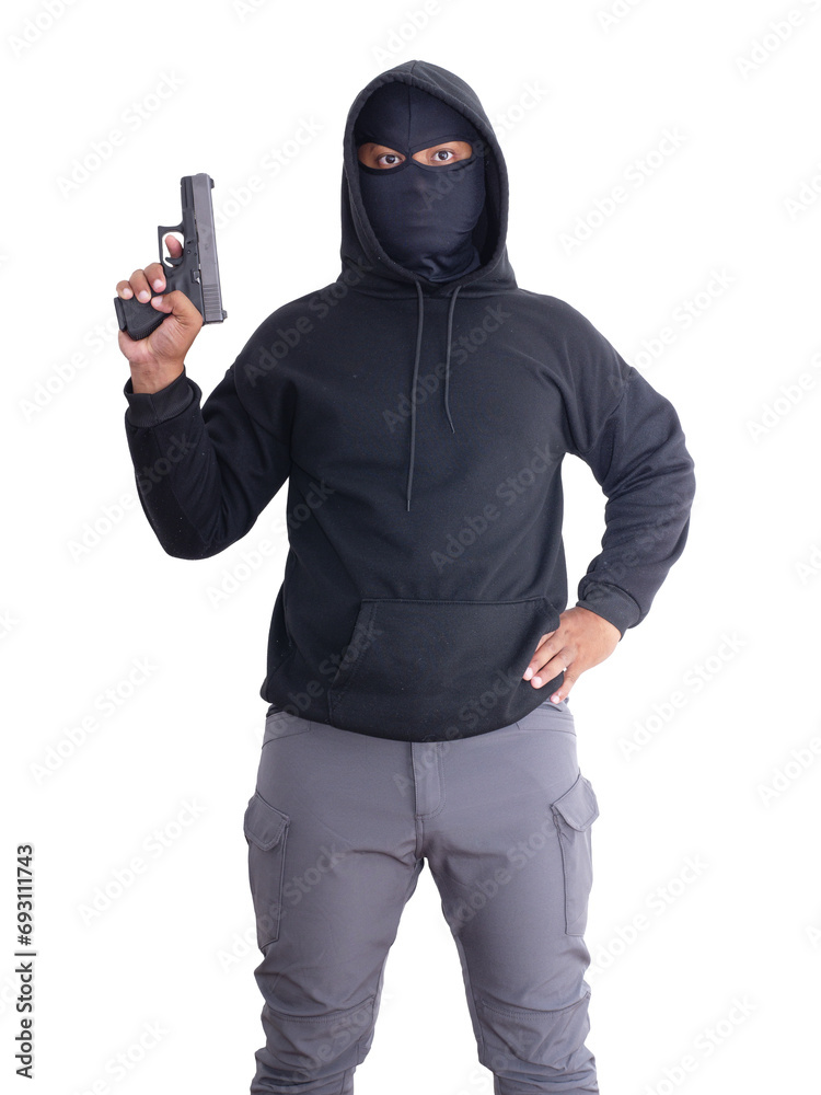 Unidentified male criminal wearing a black hoodie and covering his face, holding a pistol and aiming. On a white background with cliping path. thief.weapon, crime.burglar,cat paw,burglar