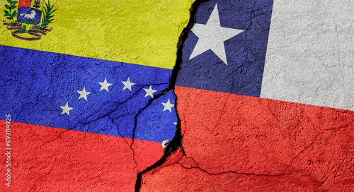 Venezuela and Chile flags on a stone wall with a crack, illustration of the concept of a global crisis in political and economic relations