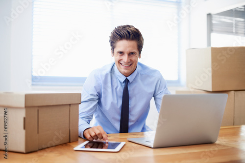 Businessman, moving boxes and smile for laptop, entrepreneur and online logistics for courier. Happy male person, professional and delivery for company distribution, package and shipment by internet