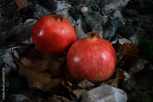 red pomegranate on nature leaf and foliage. Christmas 