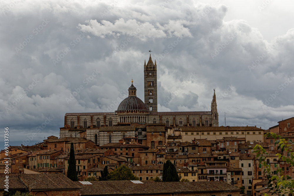 Fototapeta premium Siena. Old Medieval city in Tuscany in Italy Europe. Art and culture. Tourists from all over the world for Piazza del Campo Palio Duomo Tower del Mangia and the oldest bank banco dei Paschi 