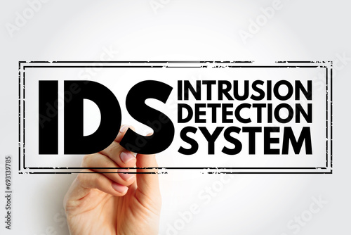 IDS - Intrusion Detection System is a device or software application that monitors a network or systems for malicious activity or policy violations, stamp acronym text concept background