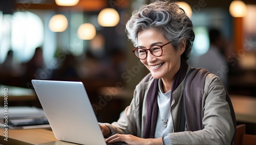 Silverscreen Productivity: Senior Lady Working on Laptop