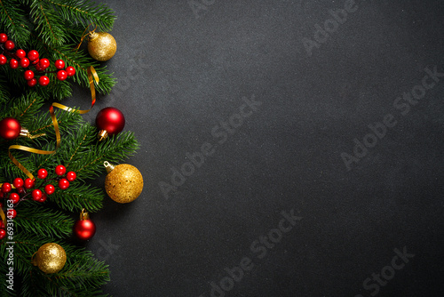 Black christmas flat lay background. Christmas tree with holidays decorations at black background.