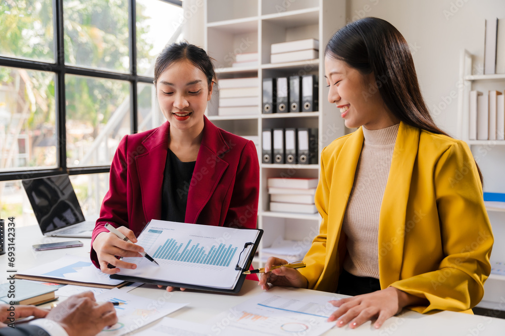 Two business leaders talk about charts, financial graphs showing results are analyzing and calculating planning strategies, business success building processes.