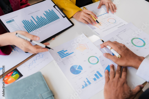 Two business leaders talk about charts, financial graphs showing results are analyzing and calculating planning strategies, business success building processes.