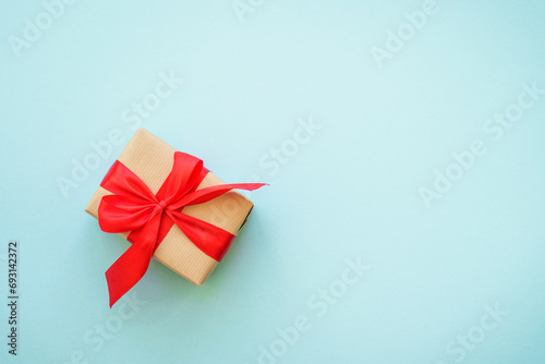 Christmas background. Christmas present boxes and holiday decorations at blue. Flat lay image with copy space.