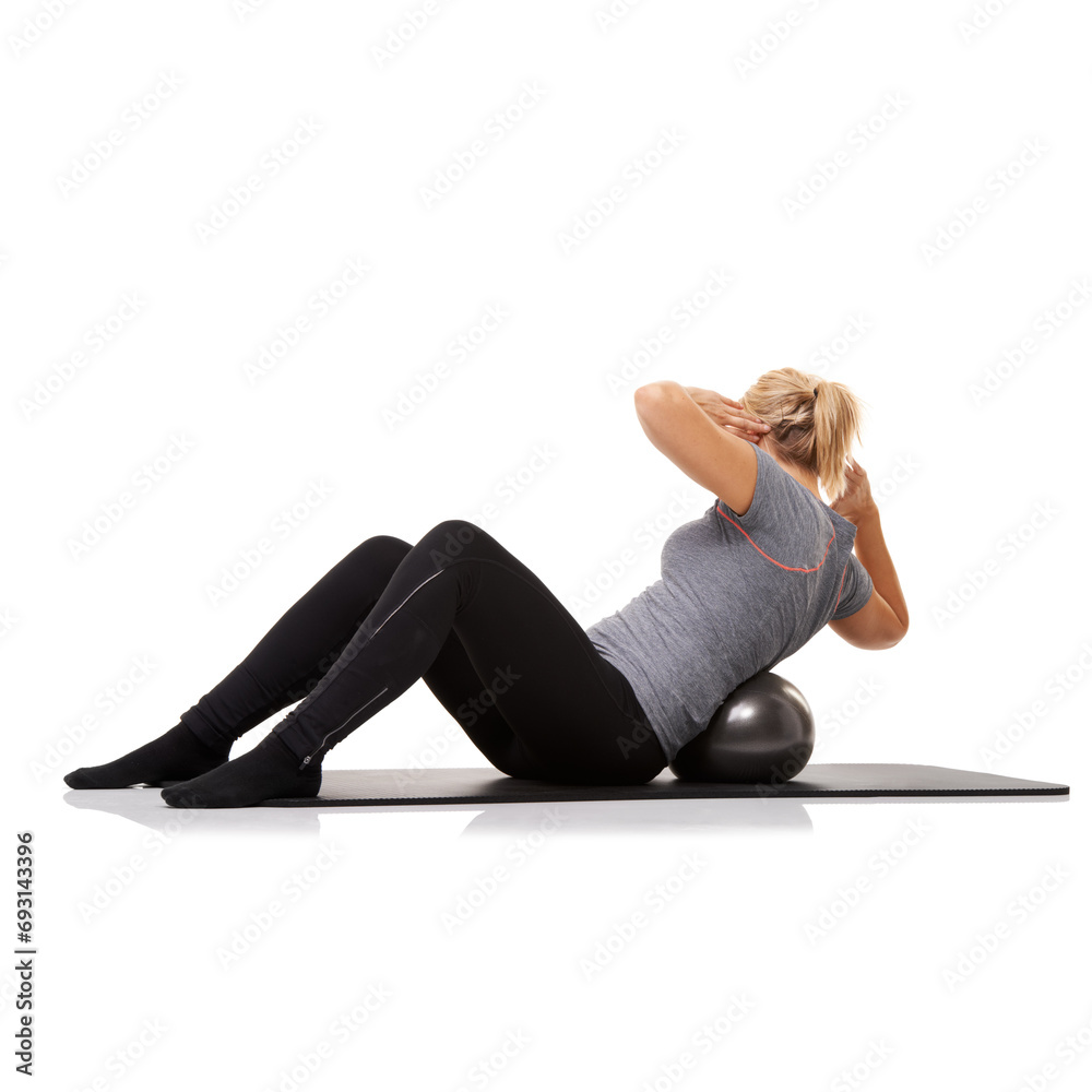 Obraz premium Fitness, exercise and woman on floor with ball for pilates, body building care and health in studio. Gym, training and girl on mat with cardio, energy and muscle workout isolated on white background.