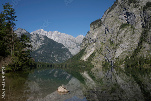 View of Obersee in Schönau am Königssee. Reflection of the mountains in the water. Germany, Europe. photo
