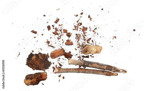 Wood pieces and dust, crushed tree bark isolated on white background, organic texture, top view