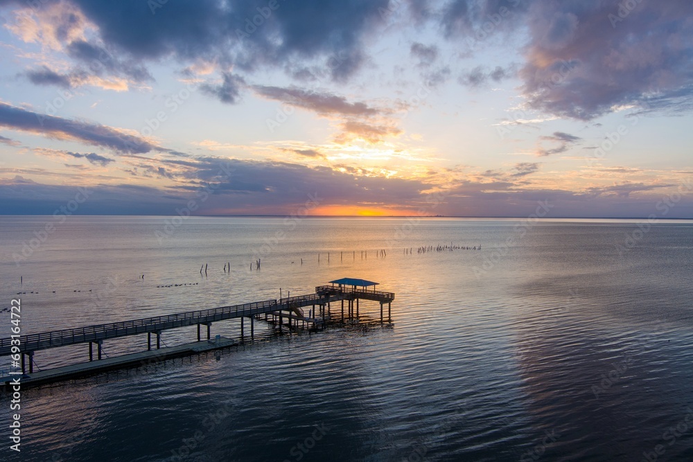 Mobile Bay pier at sunset in Daphne, Alabama