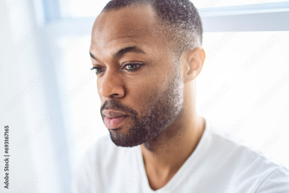 portrait of a man on white appartement with white shirt portrait of a man on white appartement with white shirt