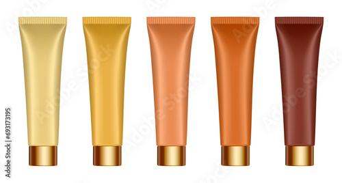 Set of yellow, beige, gold, bronze and brown tubes with gold caps. Cosmetic tube mockup. 3d illustration. Serum or cream. photo