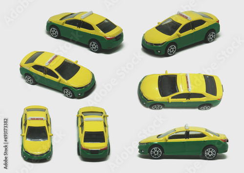 Canvas Print Yellow green steel taxi model children toy popular on street in Bangkok of Thail