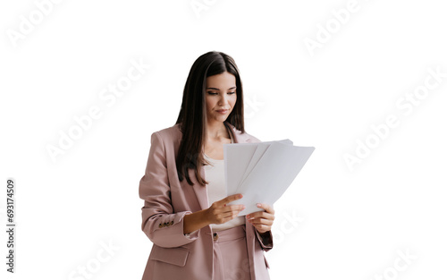 Brunette Asian businesswoman in suit holds sheet of papers looks at documents stands against transparent background. Successful lawyer explores issue at office. Financial bill.
