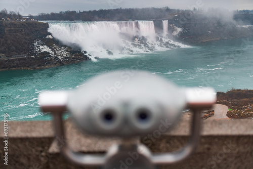 Niagara Falls seen past a tourist binocular viewer from the American side, Niagara Falls, New York photo