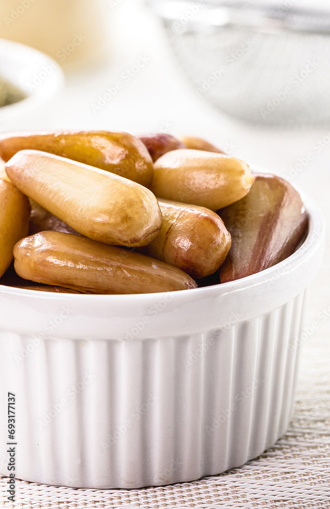 bowls with pine nuts, a typical seed from the Brazilian cuisine of the party of june bowls with pine nuts, a typical seed from the Brazilian cuisine of the party of june