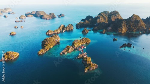 Aerial view of the West Papua's seascape. Misool region with lots of islets and tropical lagoons in Raja Ampat, Indonesia photo