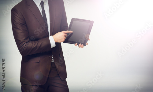 Hand, tablet and pointing with a business man on space in studio for advertising or digital marketing. Tech, mockup or presentation and a professional employee with corporate information on screen