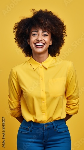 happy black woman with yellow shirt and a yellow background