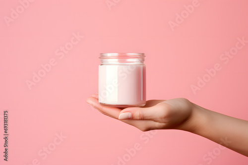 Female hands holding jar of cosmetic cream Cosmetic beauty product branding mockup photo