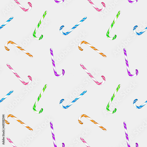 Multicolored Christmas candy canes in a seamless pattern on a gray background