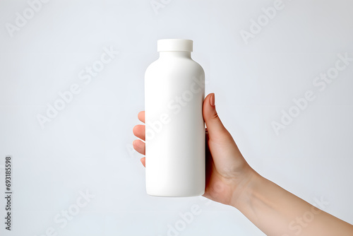 Female hands with White empty cosmetic liquid  bottle of soap  lotion  shampoo or shower gel mock up isolated