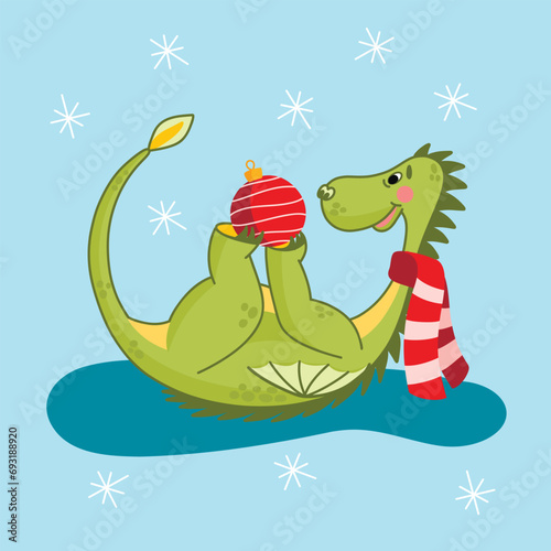 Christmas green dragon with a Christmas tree toy and a red scarf, a symbol of the new year, a happy dragon, snowflakes.