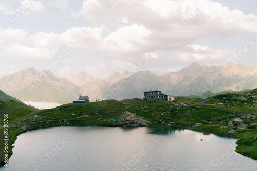 Pombie refuge with people under the Midi d'Ossau. Pyrenees National Park photo