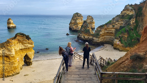 Ponta Da Piedade Rocks Near Lagos in Algarve, Portugal. Cliff Rocks, Seagulls and Tourist Boat on Sea at Ponta Da Piedade, Algarve Region, Portugal. Hiking Rota Vicentina the Fisherman's Trail