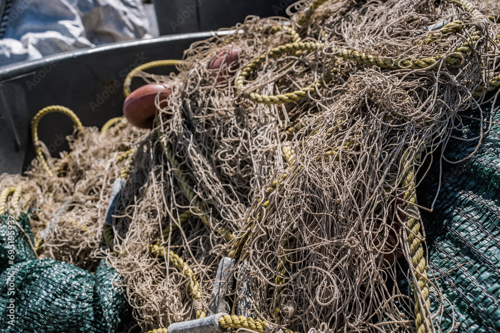 Selective focus of tangled fishing net lines with blur background