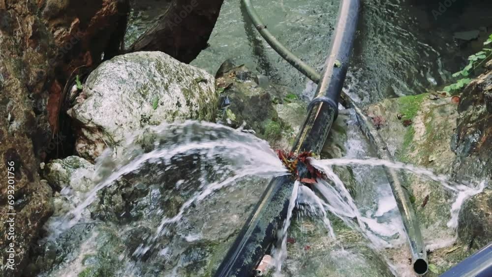 Breakdown captured Water bursts from pipe, symbolizing infrastructure ...