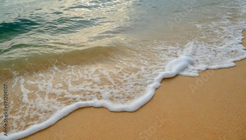soft ocean wave on the sandy beach background