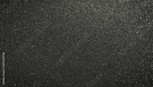 metallic glitter black background close up dark gray paper backround black glitter background from wrapping paper