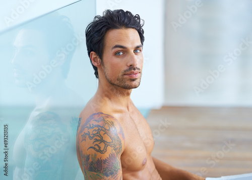 Man, shirtless and portrait for relax confidence on vacation holiday, weekend rest or casual day. Male person, topless and face or tattoo ink for cool edgy look or proud muscle, chest or fit healthy