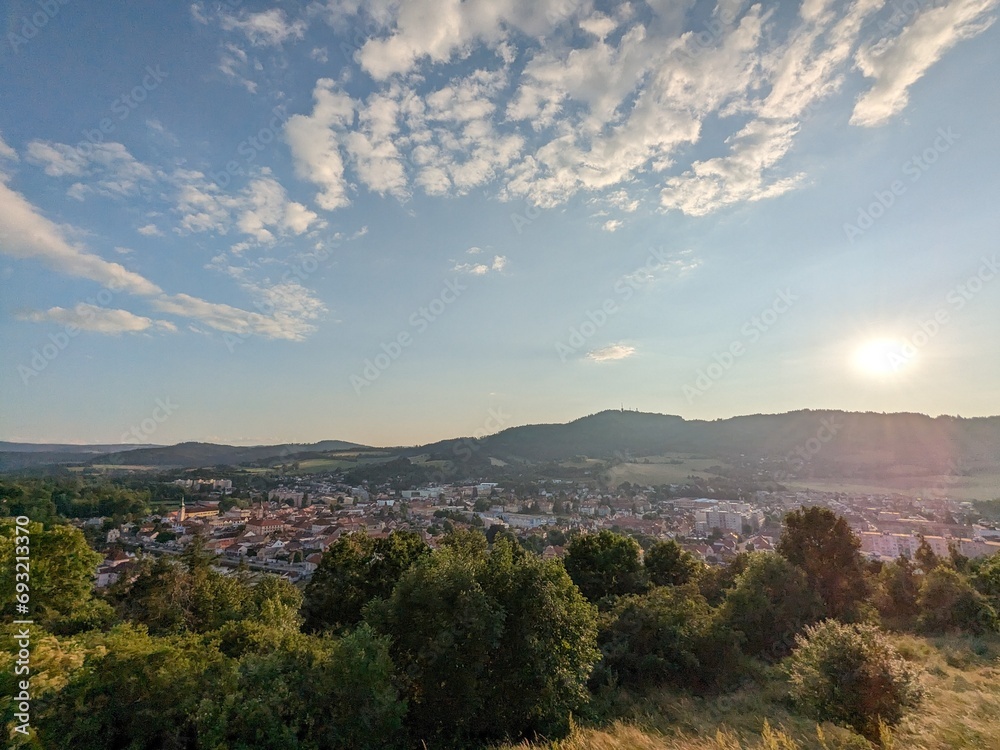 Fototapeta premium The church above Susice town in the Sumava region, Bohemia, Czech Republic, is a popular landmark for watching sunsets. The perfect spot for breathtaking views over the landscape. 
