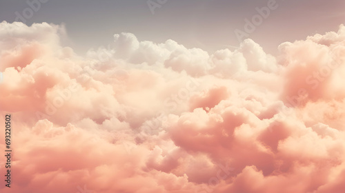 Dreamy skyscape with soft peach fuzz and pink clouds, resembling cotton candy, stretching across the horizon in a tranquil and soothing display of nature's beauty photo