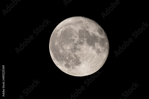 Obraz na płótnie Full moon photographed with a telescope and reflex camera where the craters on the lunar surface can be seen. The seventh continent will be the destination for space travel and future moon landings w salonie