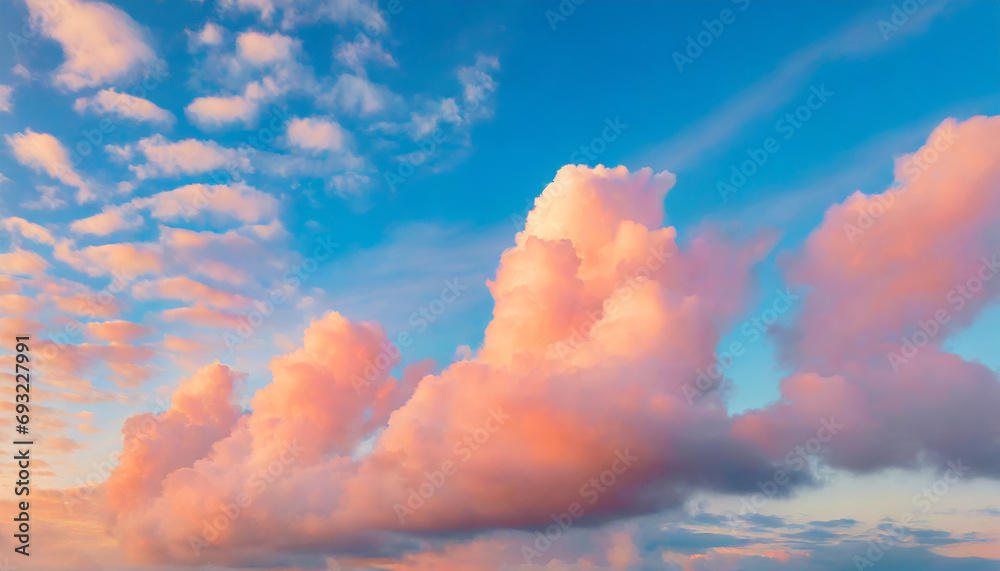 Beautiful natural background with blue sky and pink fluffy clouds at sunset Beautiful natural background with blue sky and pink fluffy clouds at sunset