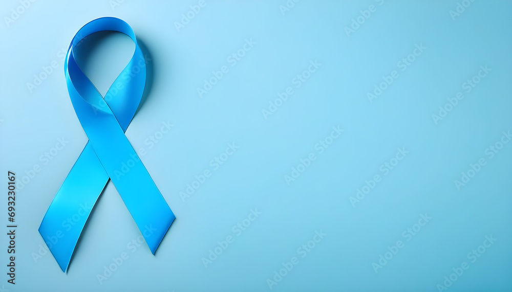 Blue ribbon on solid background with copy space. Movember campaign symbol. Prostate cancer awareness month.