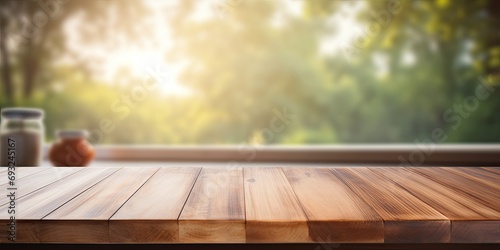 Unoccupied wooden table with blurred kitchen bench backdrop photo